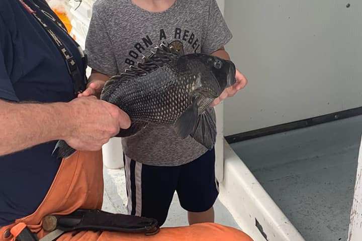 a man and a woman wearing a hat