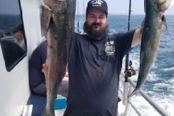 a man holding a fish