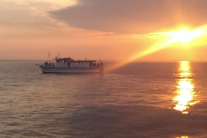 a sunset over a body of water
