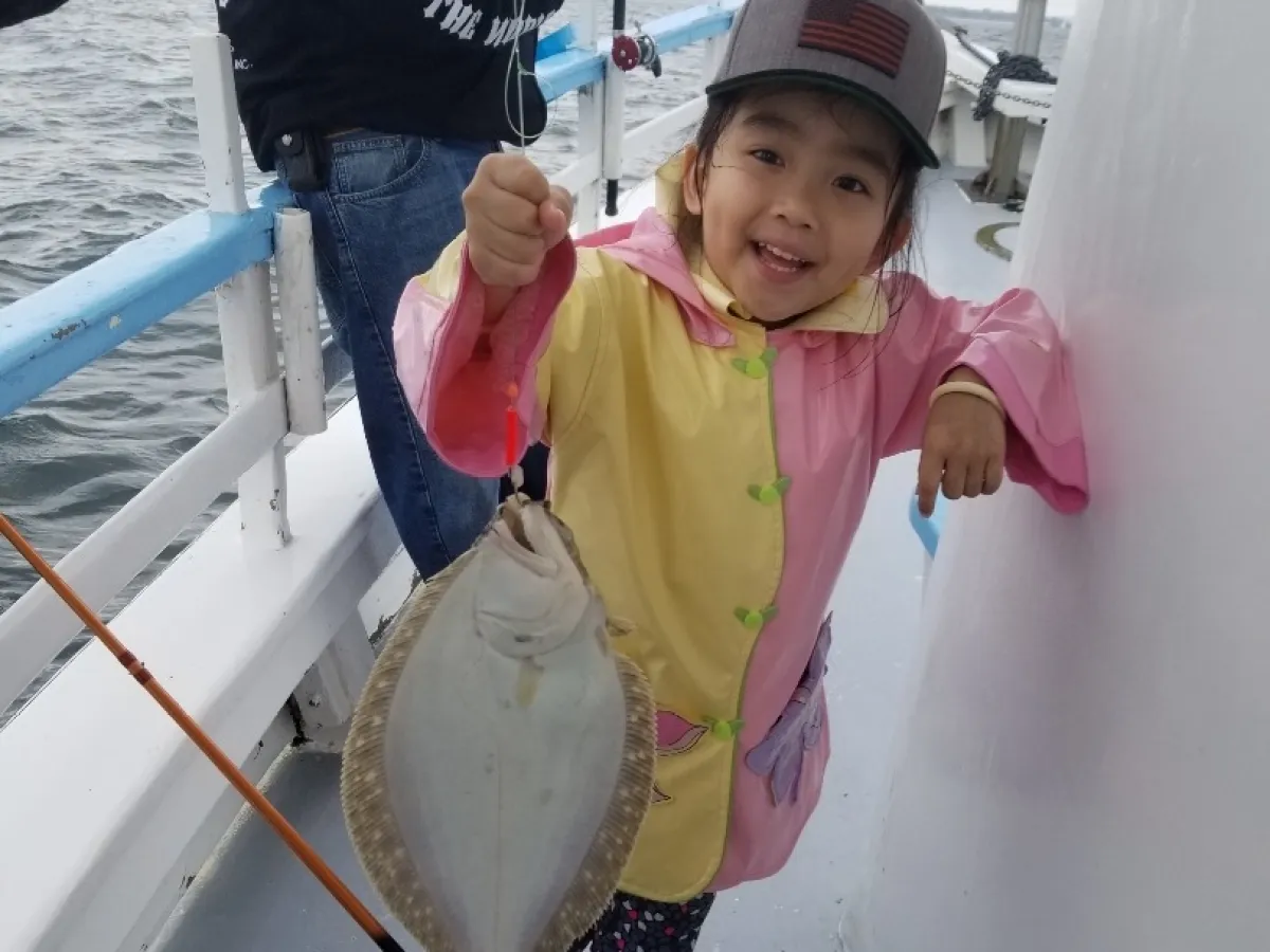 Maddox Jolie-Pitt holding a baby