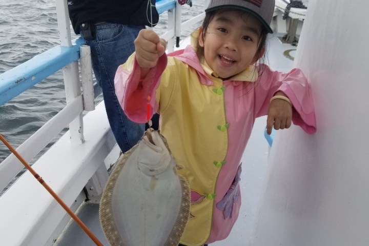 Maddox Jolie-Pitt holding a baby