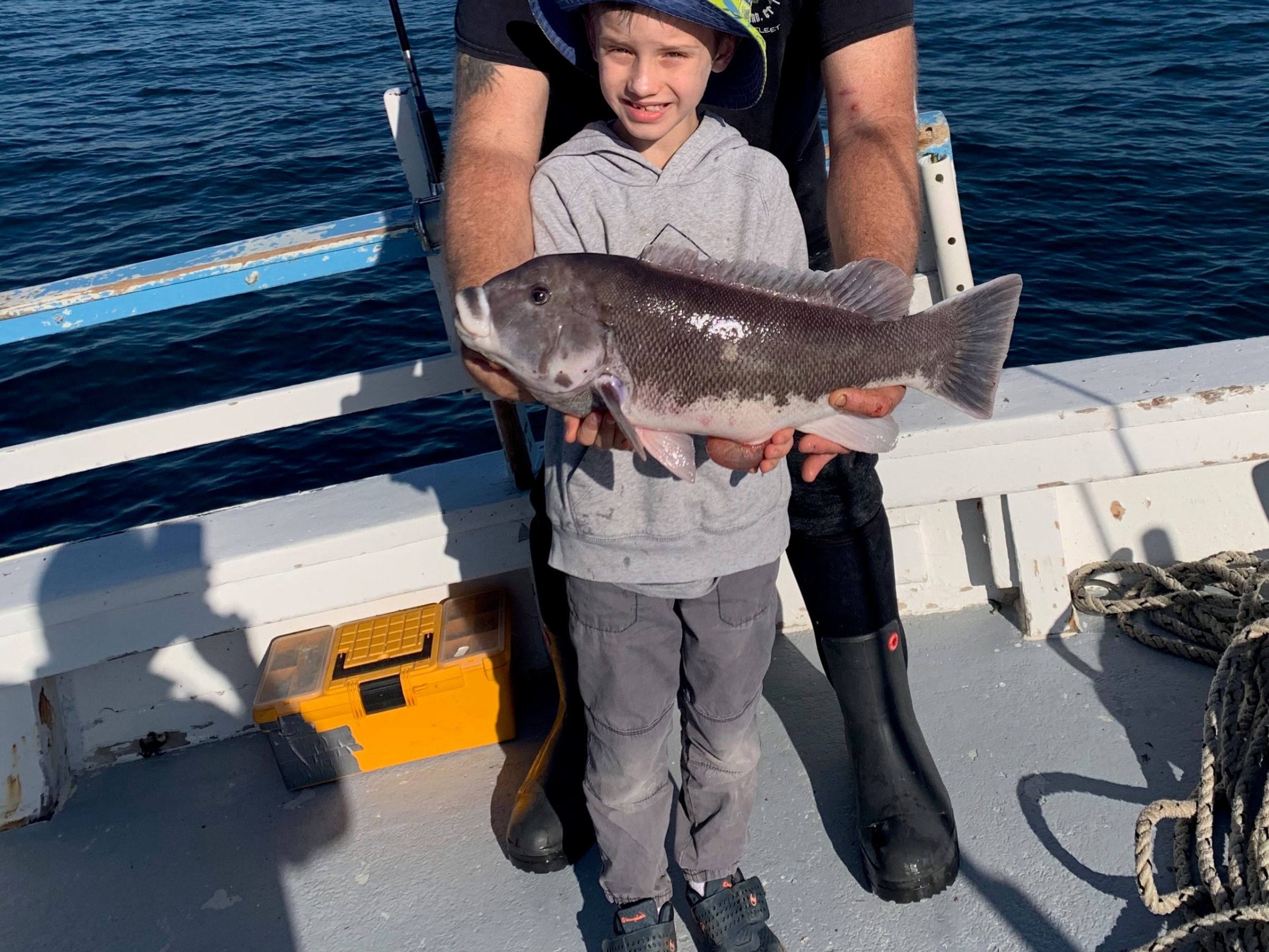 a person holding a fish in the water