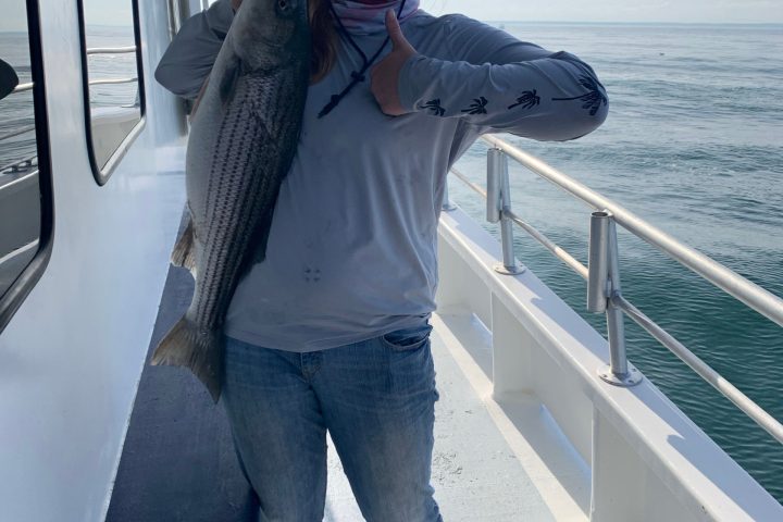 a person holding a fish