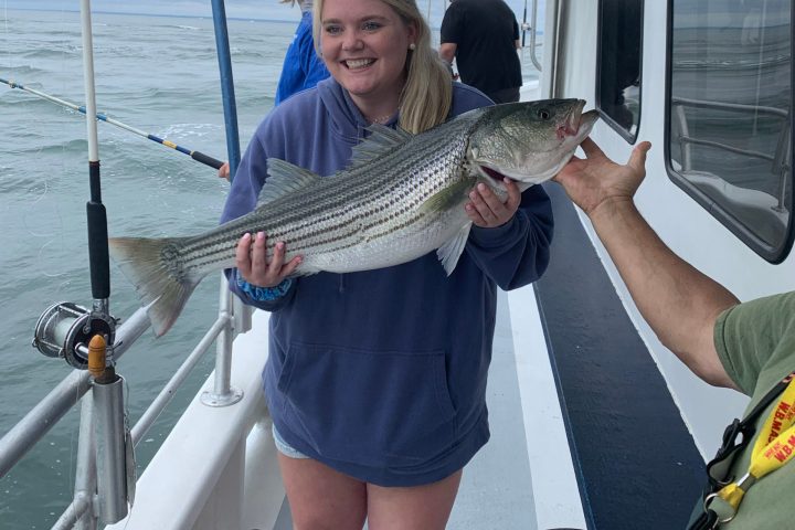 a person holding a fish