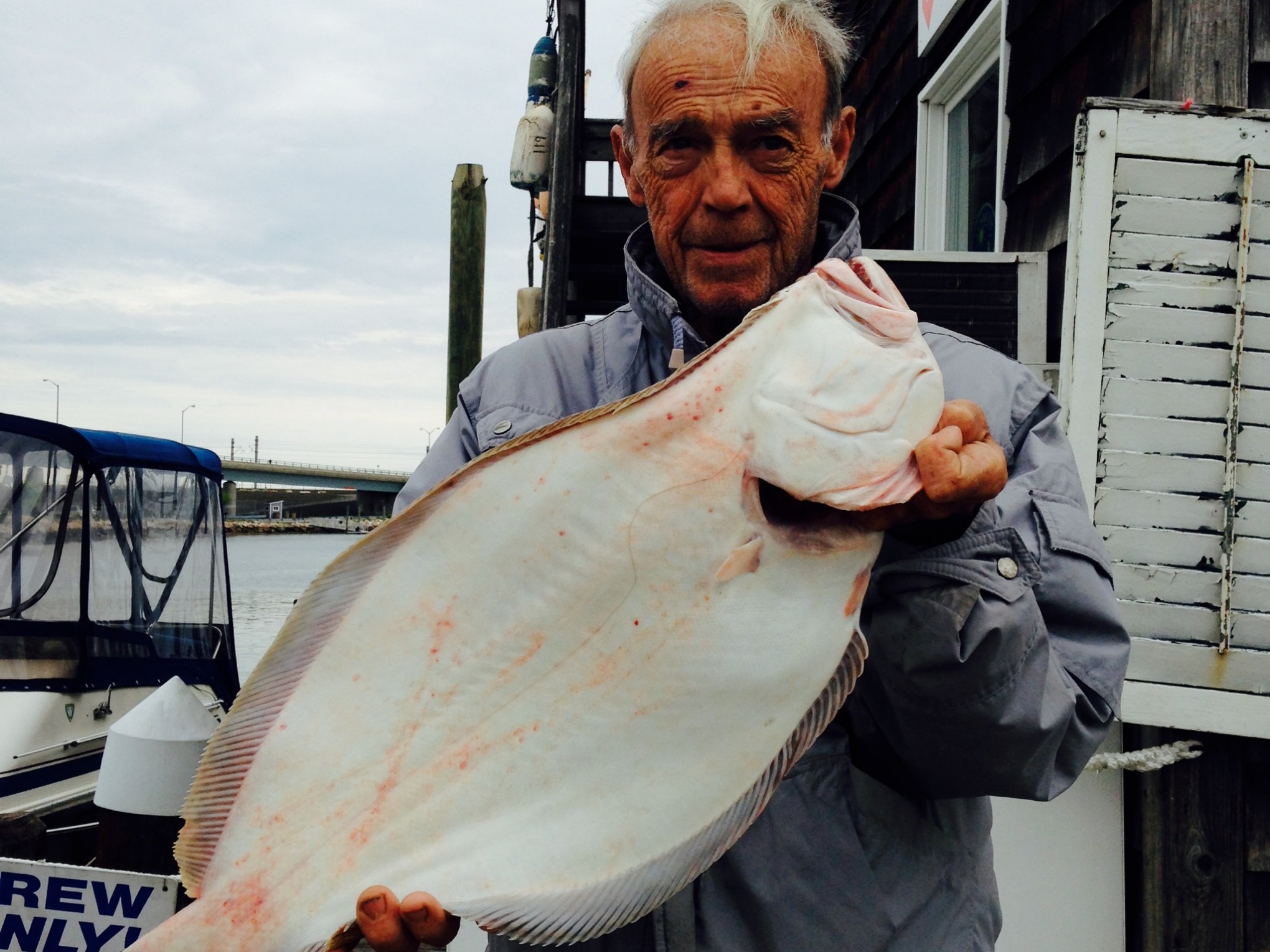 a man holding a fish