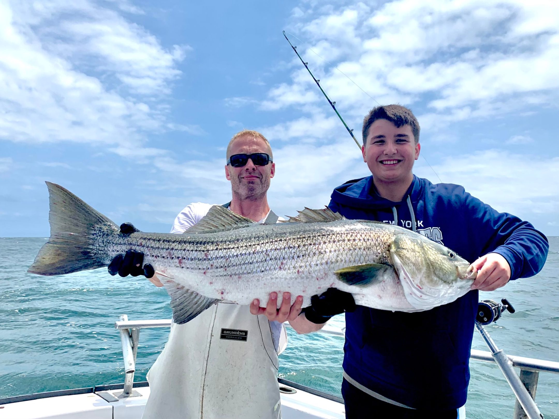 a person holding a fish in the water