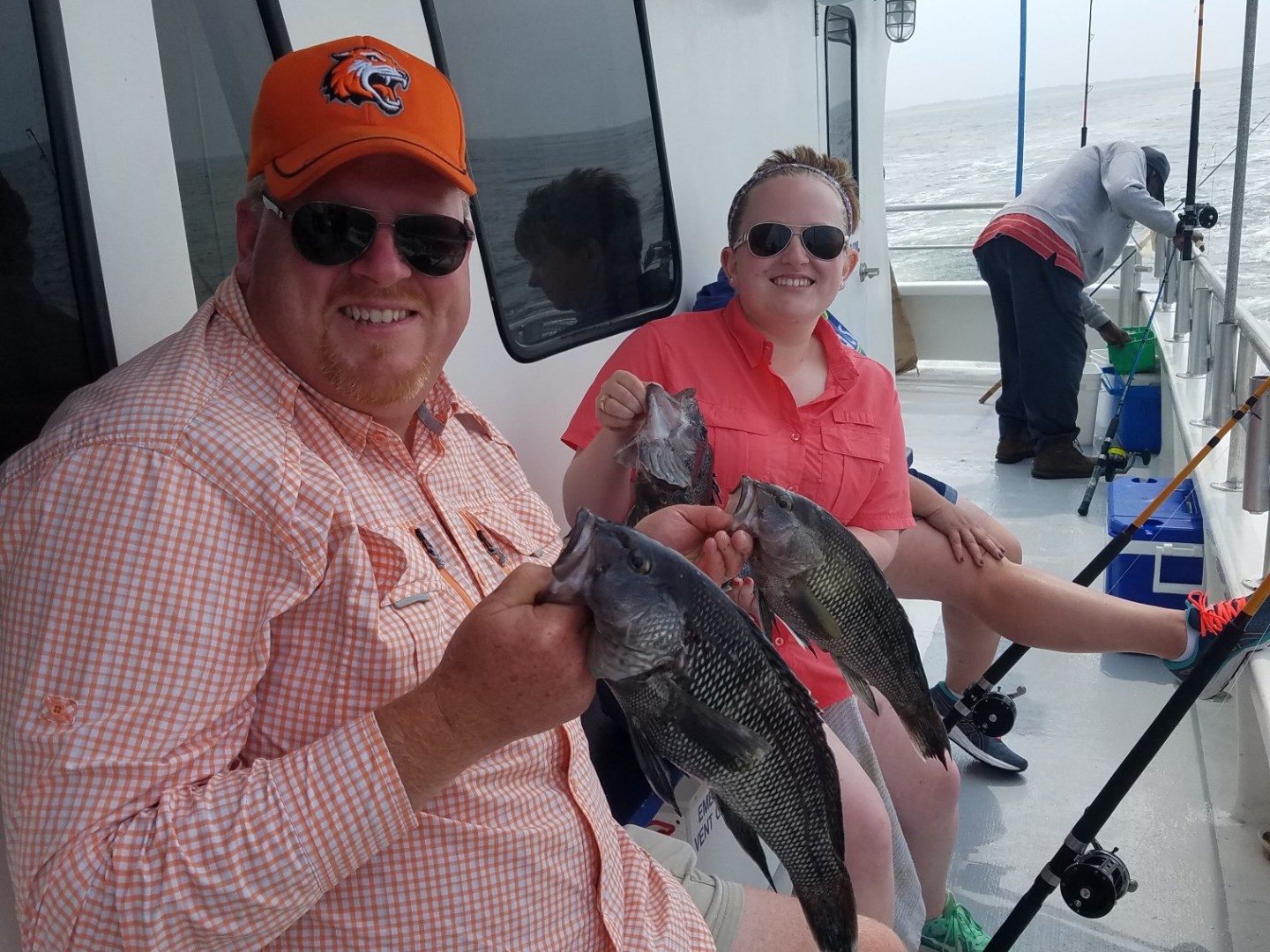 a man and a woman wearing a hat