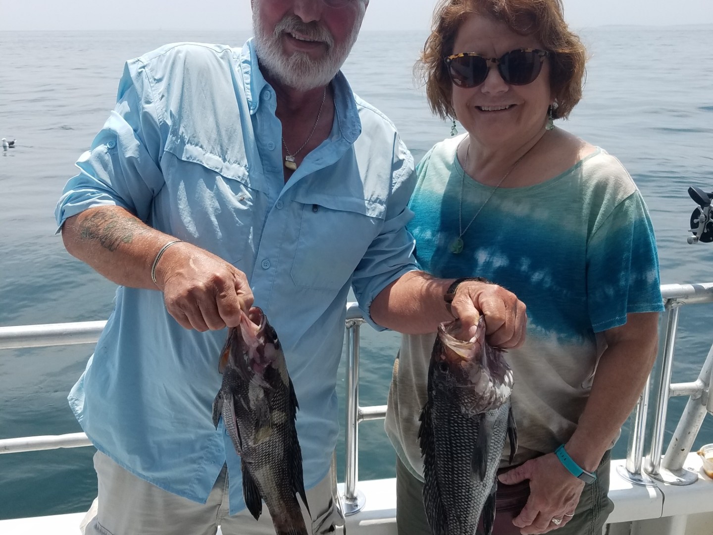 a man holding a fish
