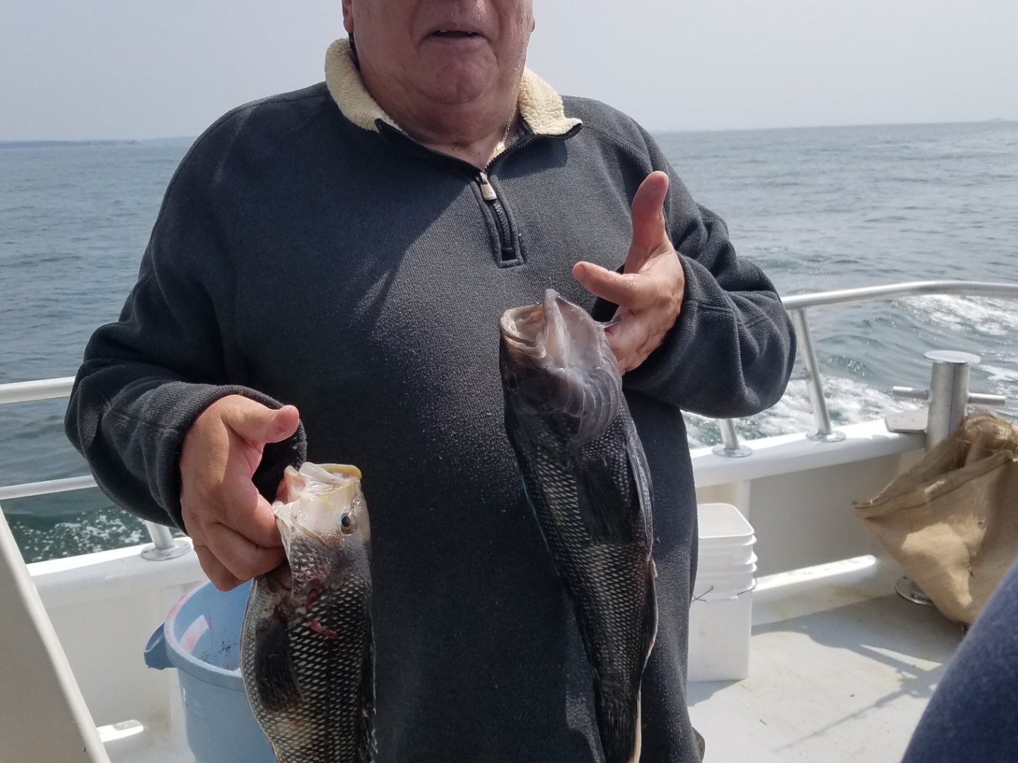 a man holding a fish in the water